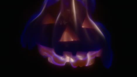 slow motion close-up of a jack-o-lantern on fire