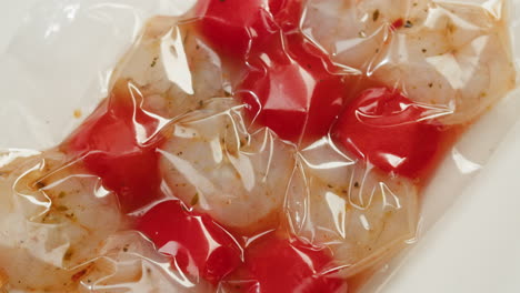 vacuum-sealed shrimp with tomatoes and marinades
