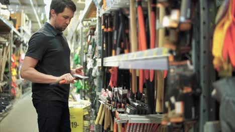 man shopping for tools in a hardware store