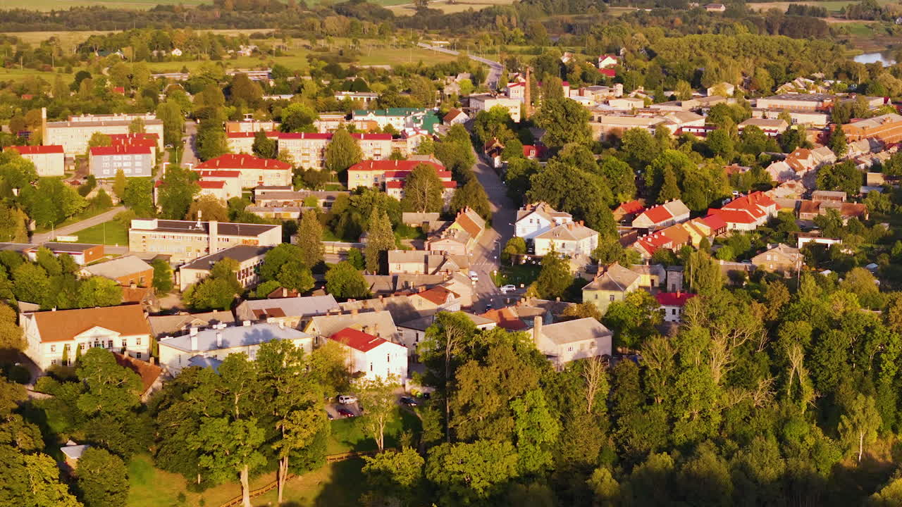 Travel, History, And Tourism In Aizpute, South Kurzeme, Latvia. 4K Aerial Zoom Out Over One Of The Oldest Towns In Latvia.