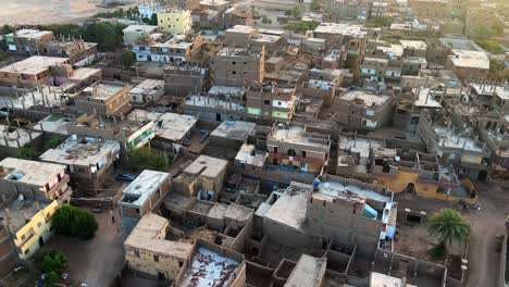 Fly-over-Luxor,-Valley-of-the-Kings-in-Egypt-in-a-Hot-Air-balloon-at-sunrise-overlooking-historical-sites