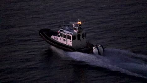 police patrol boat driving at night