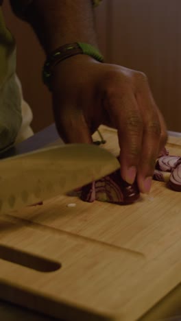 person cutting onion