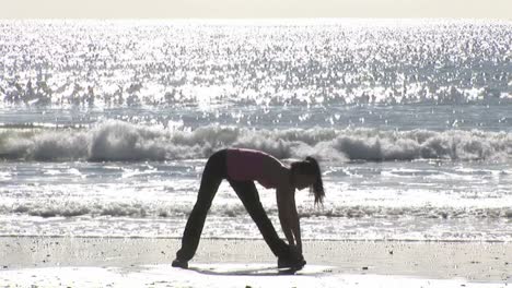 woman working out at beach