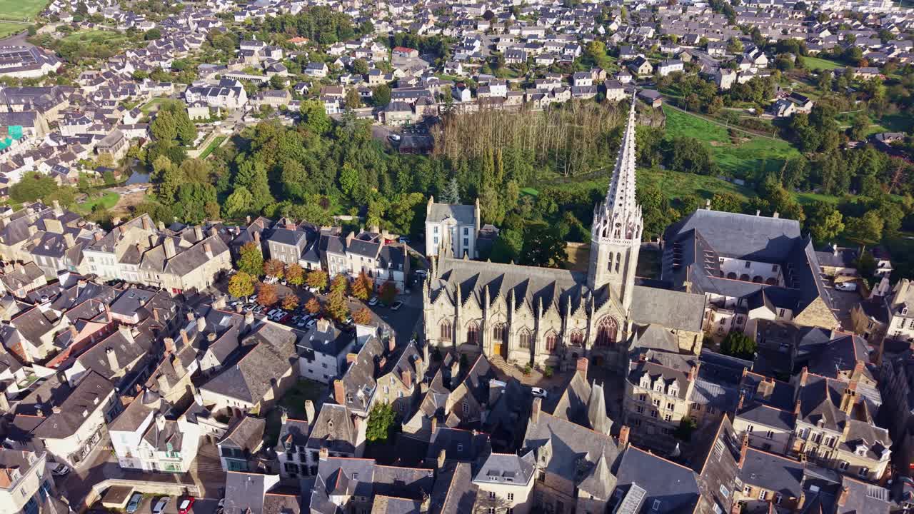 Panning drone fly near Church of Notre Dame of Vitré around Vitré residential area, Ille-et-Vilaine, France