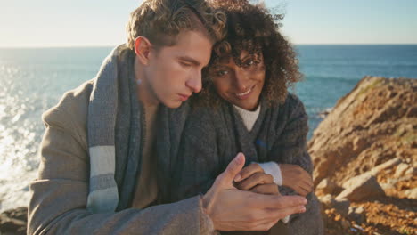 tender pair hugging beach day vacation family trip at sea background closeup