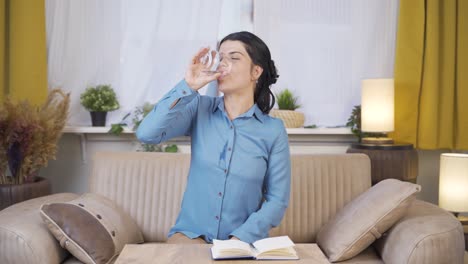 young woman drinking water for healthy life.