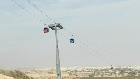 cable car of the aerial tramway connecting oufella peak and agadir city in morocco, overlooking a panoramic view of the beach-20