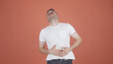 man experiencing stomachache.