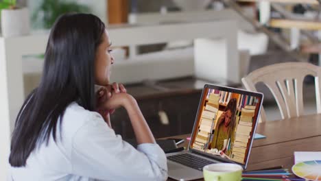 Caucasian-female-teacher-using-laptop-on-video-call-with-female-student