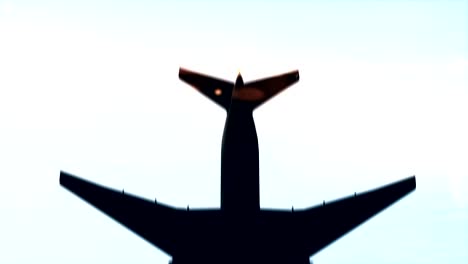 slow motion shot of a plane passing overhead.