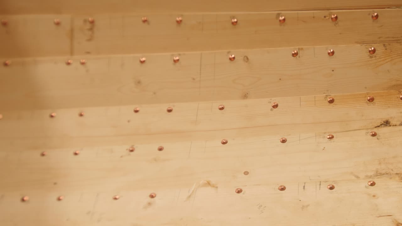 Copper Rivets Securing Clinker Planks on Wood Boat