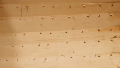 copper rivets securing clinker planks on wood boat