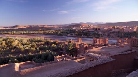 panning wide shot of the river and desert valley under ait ben haddou in morocco