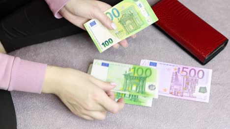 girl sitting on the couch counting money, money concept