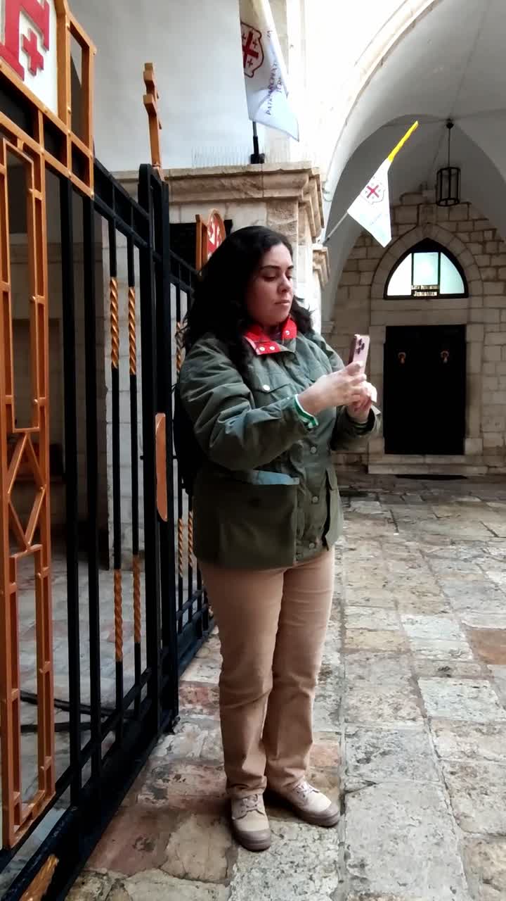 Young Woman Tourist Taking Photos with a Phone in Jerusalem