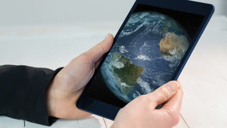 man using tablet with world technology