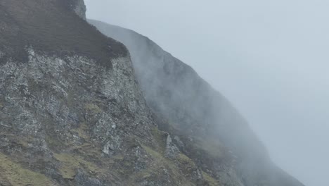 close-up drone shot of the achill cliffs during a cloudy morning
