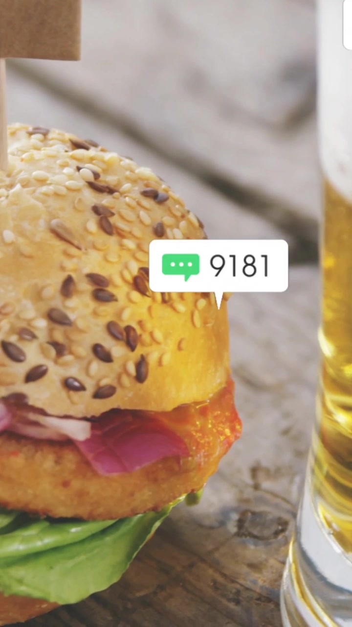 Vertical video: Bell pinging, alerts rising on mug, view shifting left to burger, showing menu buzz