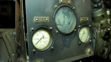 old diesel back up generator gauges inside the abandoned soviet underground bomb shelter, old soviet cold war bunker, apocalypse, handheld medium close up shot