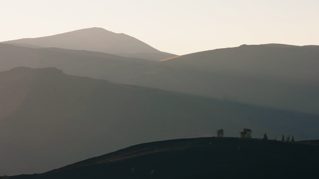 Layered Mountain Silhouettes at Dawn or Dusk