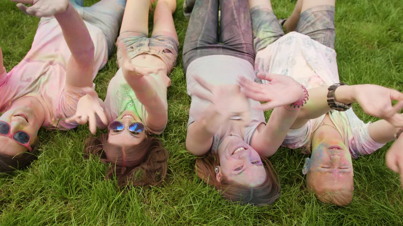 Holi Festival Celebrants Waving at the Camera