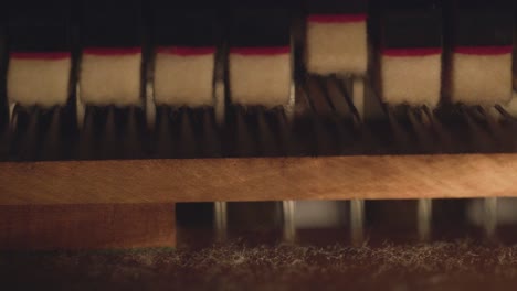 close up detail of piano strings and hammers , abstract music video artistic footage music instrument