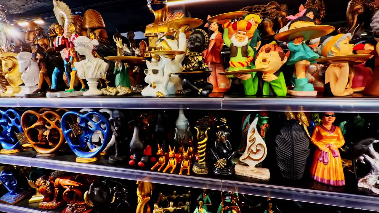 Various Figurines And Sculptures At The Local Gift Shop In Sharm El Sheikh, Egypt. Close-up, Pan Left Shot