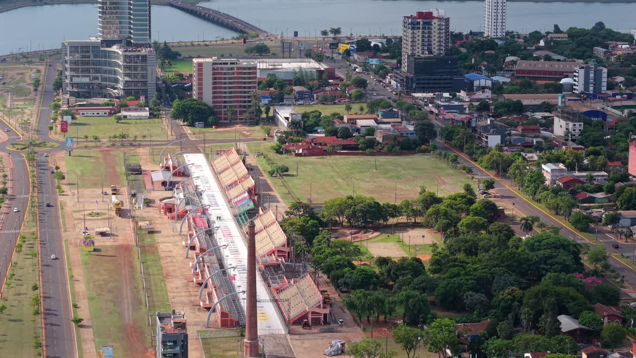 Urban aerial view of the Costanera Shopping Center of Encarnación with residential buildings and the Sambodromo, Paraguay.