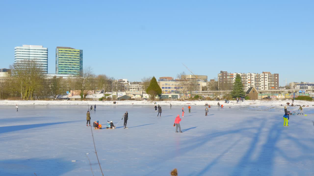 People ice skating on frozen lake in beautiful sunny weather (5)