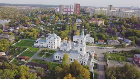 aerial view of a town with a church in autumn