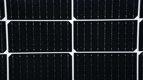 Black-higher-efficiency-Solar-Panel-cells,-zoom-out-reveals-solar-module