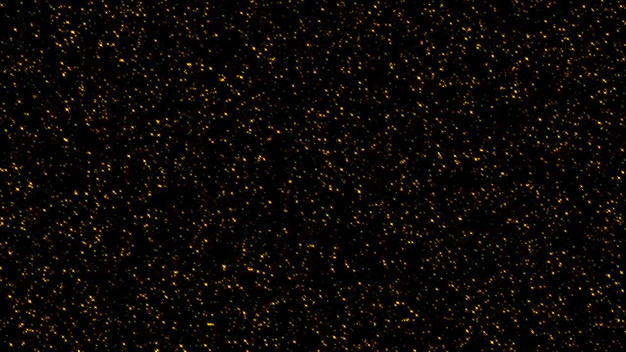 Particelle di glitter dorato che cadono su sfondo nero