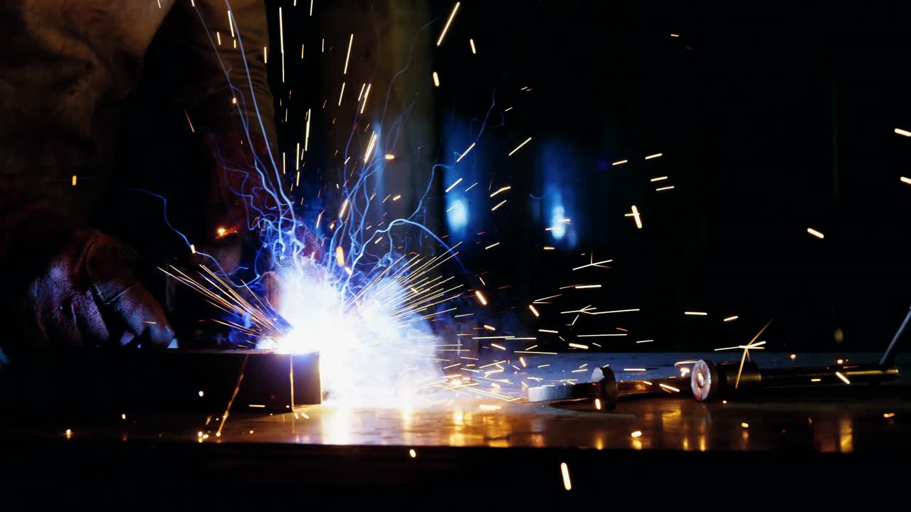 Welder welding a metal