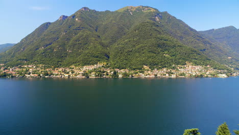 green lush mountain and lake on a sunny day 4k