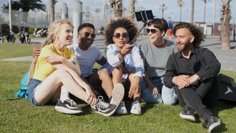 Content-friends-taking-selfie-in-city-park