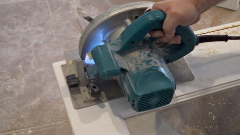 using circular saw for cutting wood door hands of the builder, man construction and home renovation, repair tools