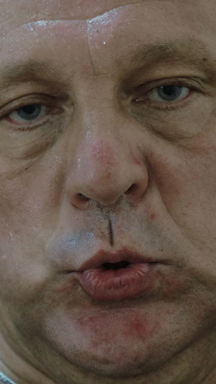 Close-up of a sweaty man's face