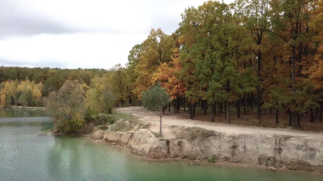 Wild forest and lake. Aerial view of blue lake and green forests