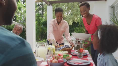 Happy-family-eating-together-at-table