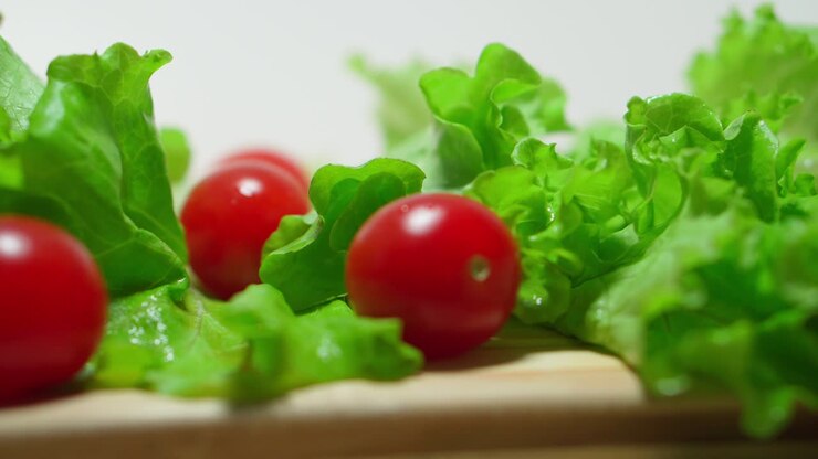 Ripe tomatoes. Lettuce leaf. Close-up. Farming, gardening