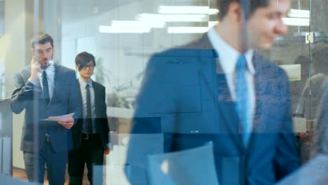 multicultural crowd of business people walking through the hallway of the corporate building. people doing business, talking, collaborating, negotiating and solving problems.