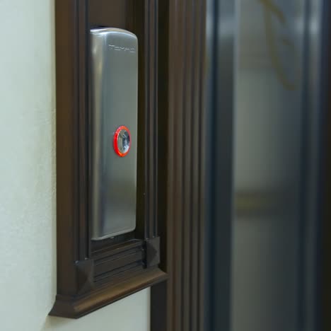 man's hand presses a lift button. man pressing elevator button in office center or hotel. progress future startup concept. close-up