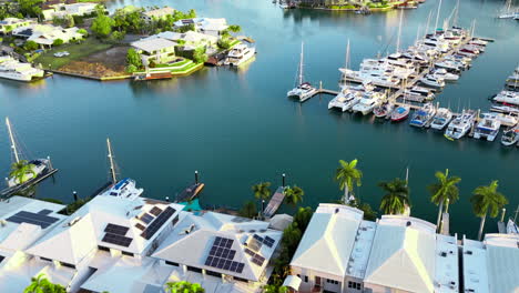 aerial drone yachts in boat marina cullen bay darwin australia surrounded by luxury real estate house homes and greenery during mid afternoon light