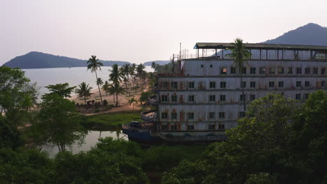 Rusting-ghost-cruise-ship-of-Koh-chang-in-marshy-lagoon,-Thailand