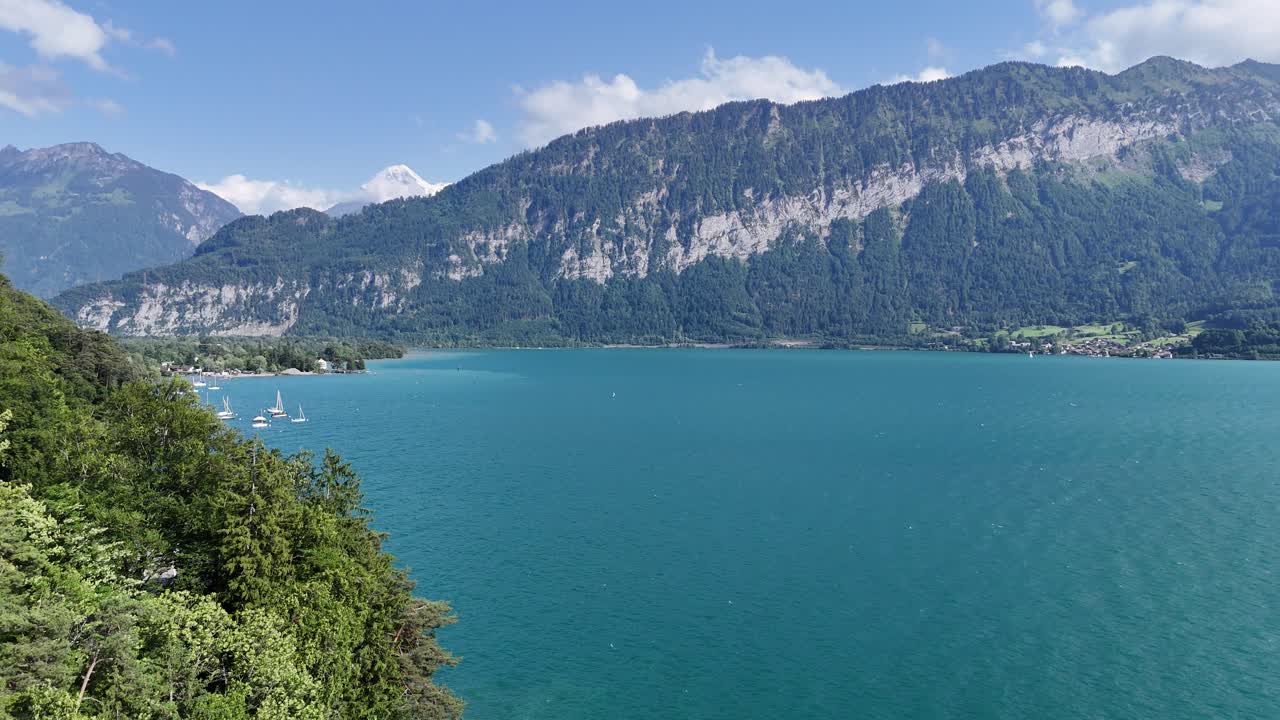 Lake Thun turquoise water Interlaken Switzerland drone,aerial reveal