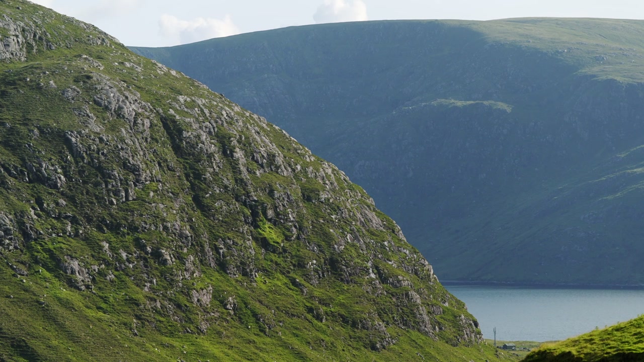 Static shot of the mountainous headland on the Isle of Harris.