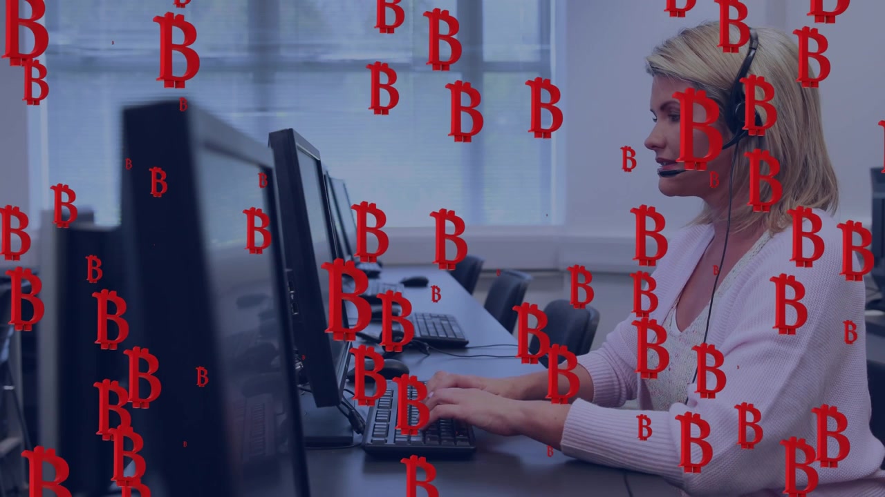 Multiple red bitcoin symbol icons against caucasian female customer executive working at office