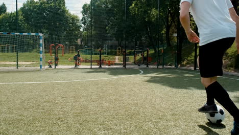 street football team training on pitch on sunny day