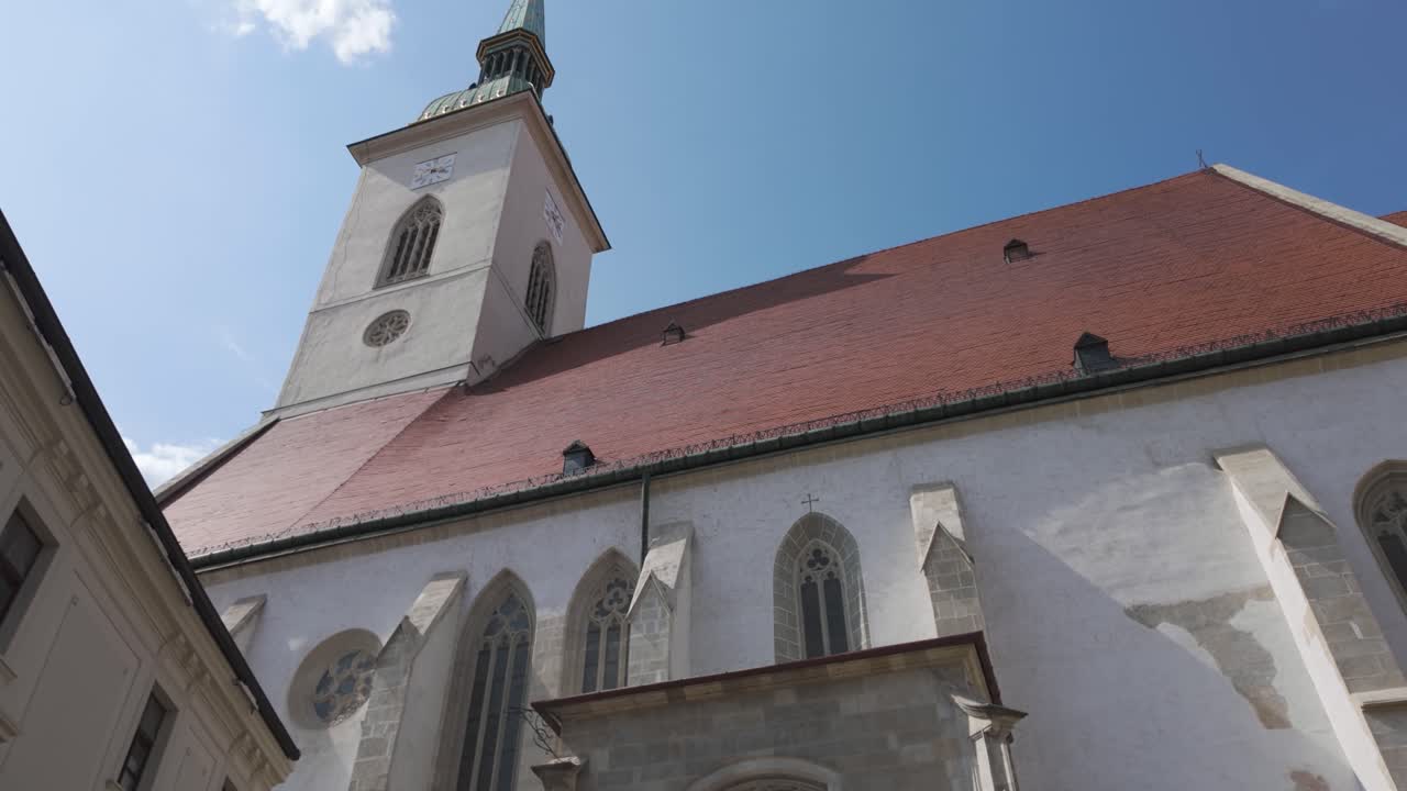 Historic Church Building with Steeple and Red Roof